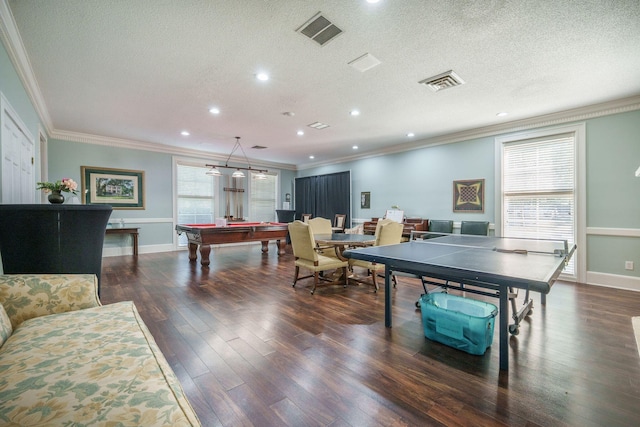 playroom with visible vents, ornamental molding, and wood finished floors