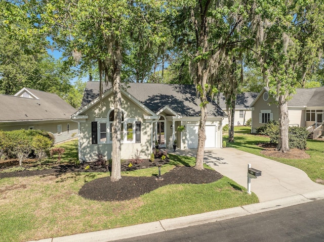 view of front of property featuring a garage, driveway, and a front lawn