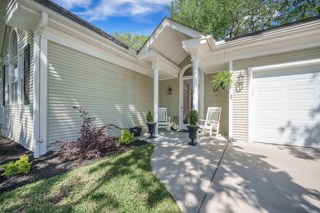 property entrance with a porch and a garage