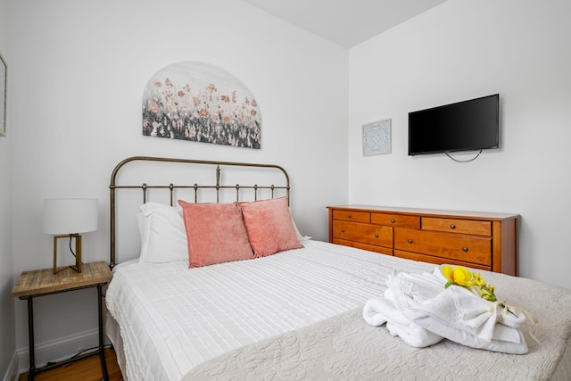 bedroom with wood finished floors