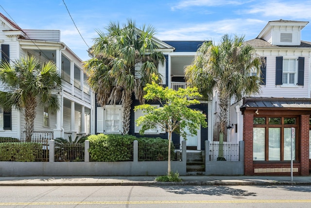 view of building exterior featuring a fenced front yard