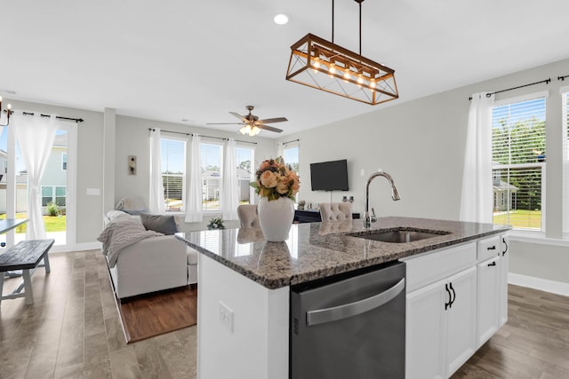 101 Patterson Ave, Goose Creek, SC 29445 - kitchen featuring stainless steel dishwasher, open floor plan, an island with sink, dark stone counters, and pendant lighting