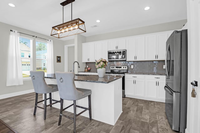101 Patterson Ave, Goose Creek, SC 29445 - kitchen featuring appliances with stainless steel finishes, backsplash, white cabinets, and recessed lighting