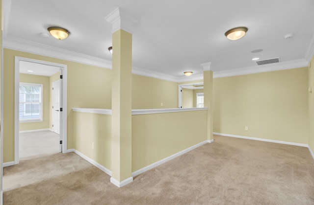 hallway with ornamental molding and light carpet