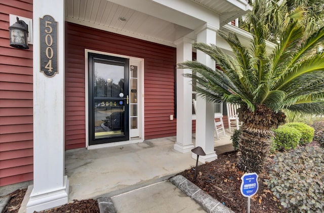 doorway to property with a porch