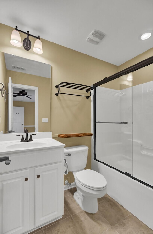 full bathroom featuring toilet, combined bath / shower with glass door, tile patterned flooring, and vanity