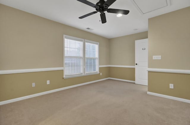 carpeted empty room featuring ceiling fan