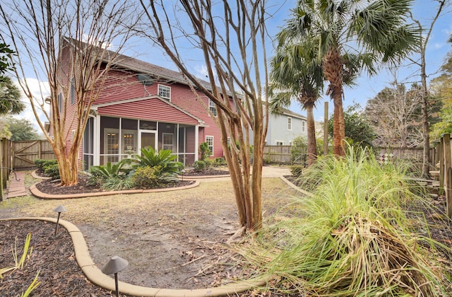 view of yard featuring a sunroom