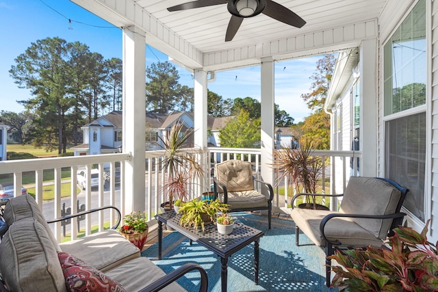 sunroom / solarium featuring wooden ceiling and ceiling fan