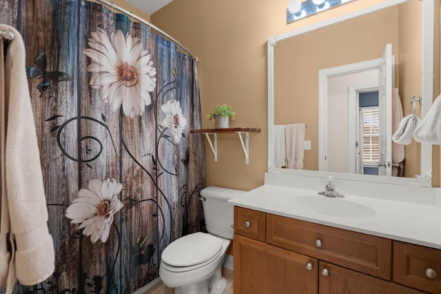 bathroom with vanity, toilet, and a shower with curtain