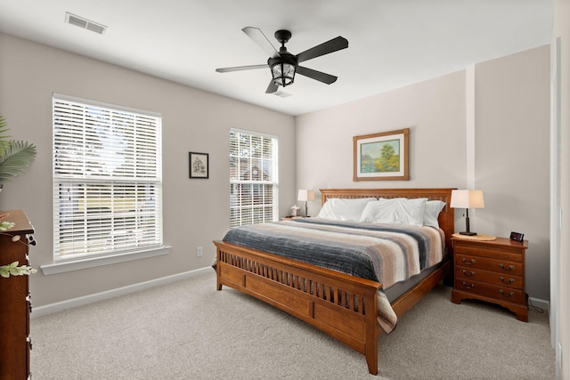 bedroom featuring ceiling fan and light carpet