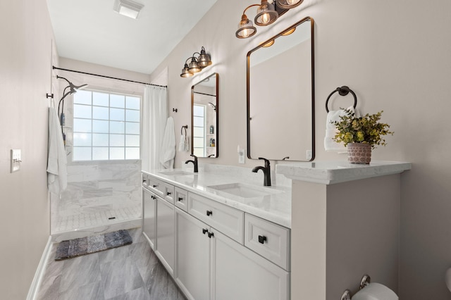 bathroom featuring vanity and a shower with curtain