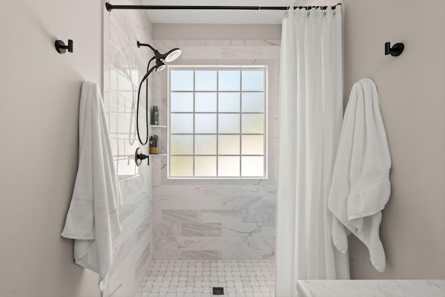 bathroom featuring a shower with curtain