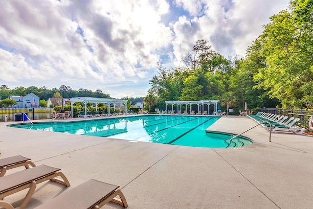 view of swimming pool featuring a patio area