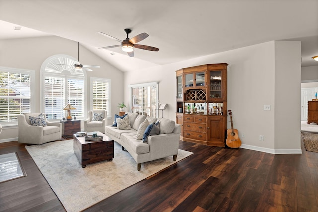 living room featuring lofted ceiling, dark hardwood / wood-style floors, and ceiling fan