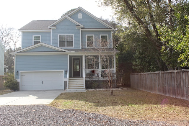 view of front facade featuring driveway, a porch, an attached garage, and fence