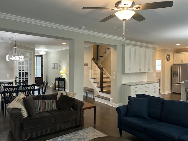 living room featuring ornamental molding, stairway, dark wood finished floors, and a wealth of natural light