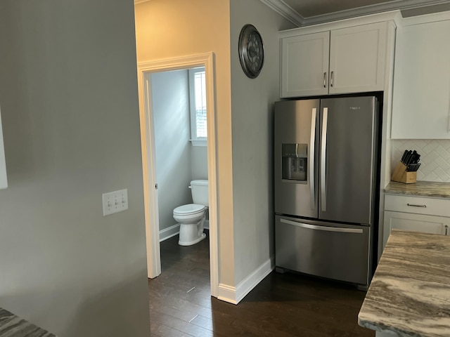 kitchen featuring white cabinetry, baseboards, backsplash, stainless steel fridge with ice dispenser, and dark wood-style floors