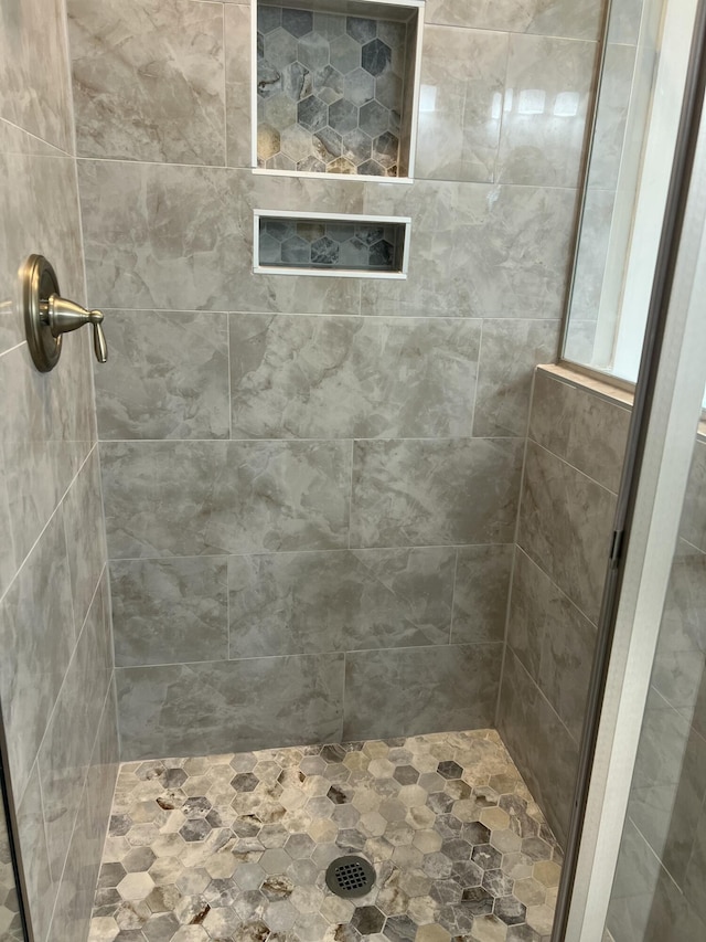 full bathroom featuring a stall shower