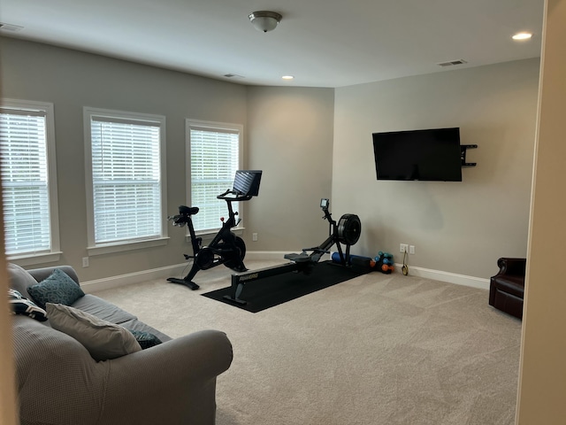 exercise area featuring baseboards, visible vents, carpet flooring, and recessed lighting