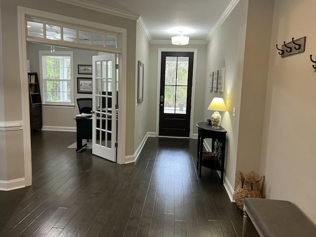 foyer with ornamental molding, dark wood-type flooring, and baseboards