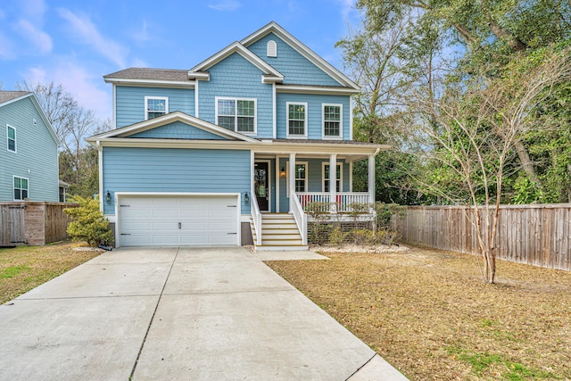 view of front facade featuring driveway, covered porch, a garage, and fence