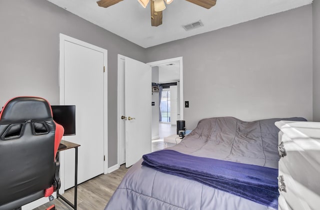 bedroom with ceiling fan and light hardwood / wood-style floors