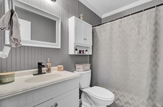 bathroom with toilet, a textured ceiling, vanity, crown molding, and a shower with shower curtain