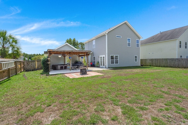 rear view of property with a yard, a patio, and french doors