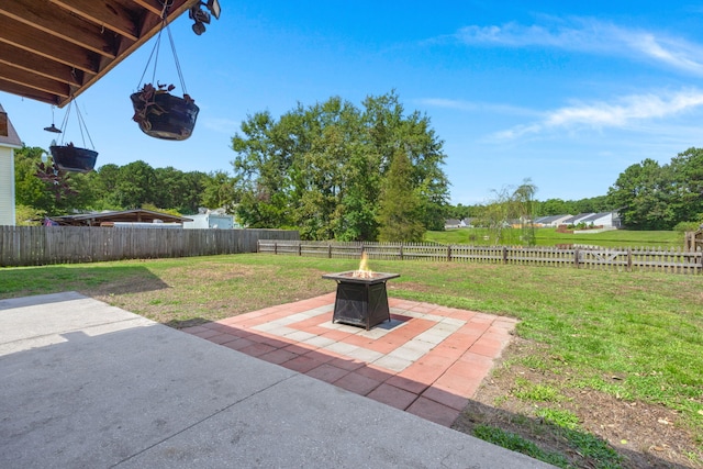 view of patio with a fire pit