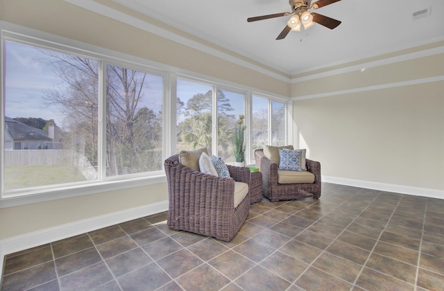 unfurnished room featuring ornamental molding and ceiling fan