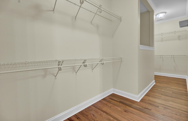 walk in closet featuring wood-type flooring