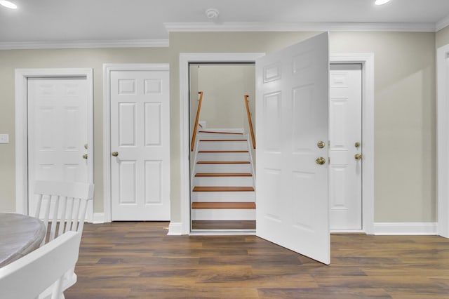 stairs with crown molding and wood-type flooring