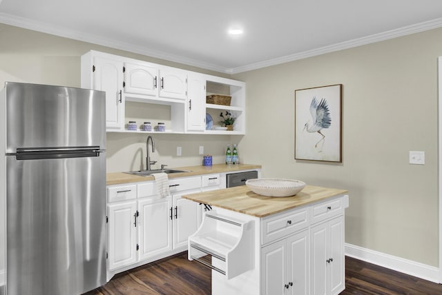 kitchen featuring sink, crown molding, white cabinetry, stainless steel appliances, and dark hardwood / wood-style floors