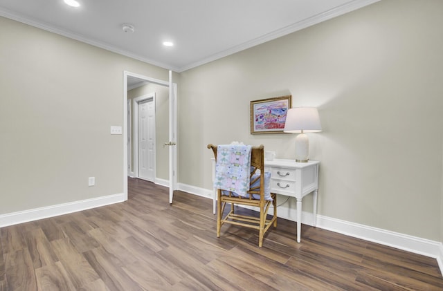 sitting room featuring hardwood / wood-style flooring and crown molding