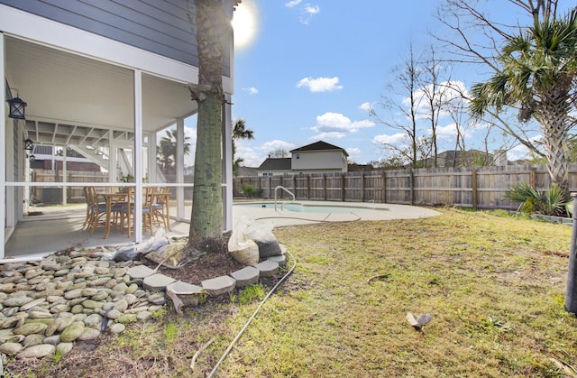 view of yard featuring a fenced in pool and a patio