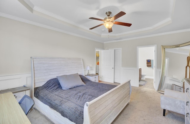 308 Legendres Dr, Goose Creek, SC 29445 - bedroom featuring a tray ceiling, ornamental molding, a wainscoted wall, light carpet, and connected bathroom