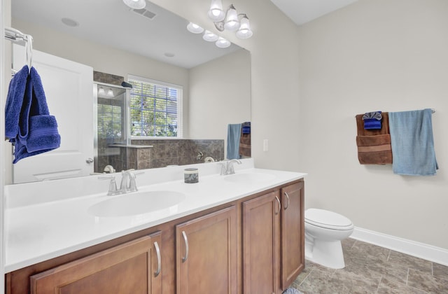 308 Legendres Dr, Goose Creek, SC 29445 - bathroom featuring double vanity, a stall shower, toilet, and baseboards