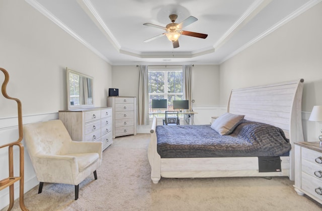 308 Legendres Dr, Goose Creek, SC 29445 - bedroom with ornamental molding, light carpet, a tray ceiling, ceiling fan, and a wainscoted wall