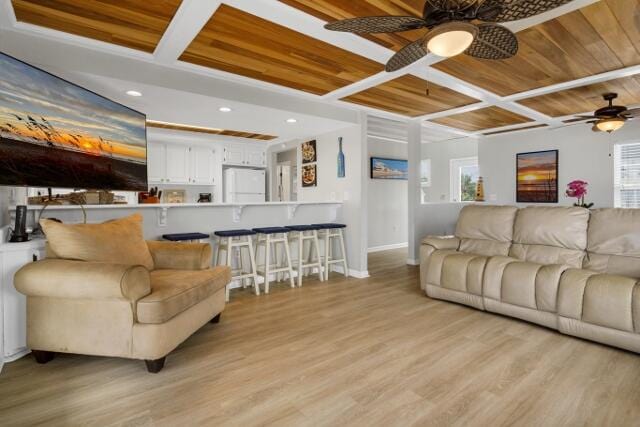 living room with ceiling fan, light hardwood / wood-style flooring, and a wealth of natural light