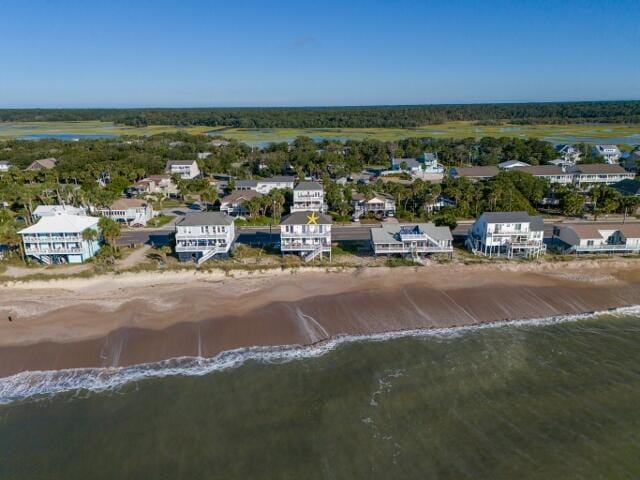 aerial view with a water view and a view of the beach