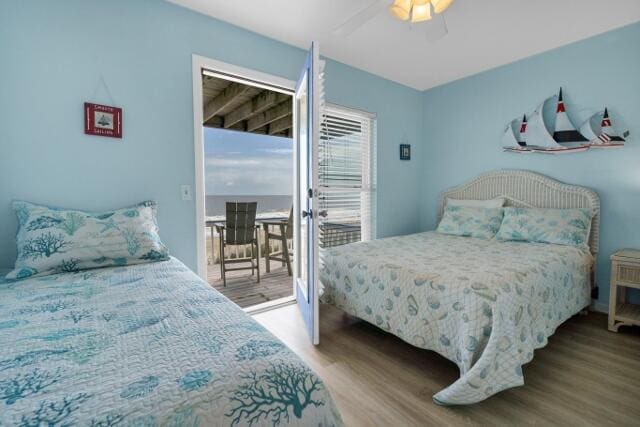 bedroom featuring ceiling fan, hardwood / wood-style flooring, and access to outside