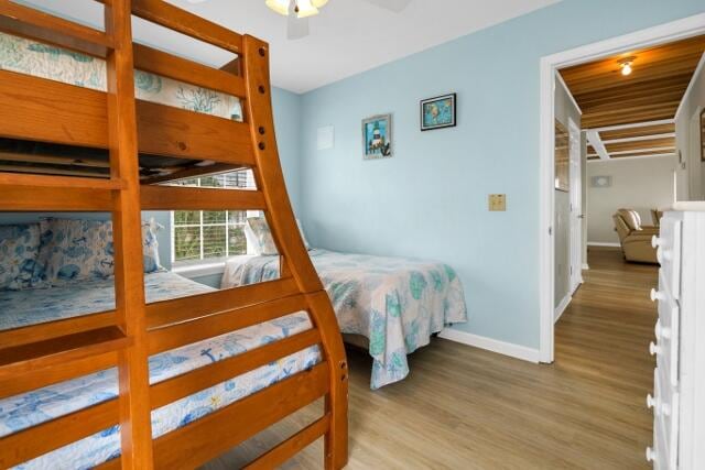 bedroom with ceiling fan, wooden ceiling, and hardwood / wood-style floors