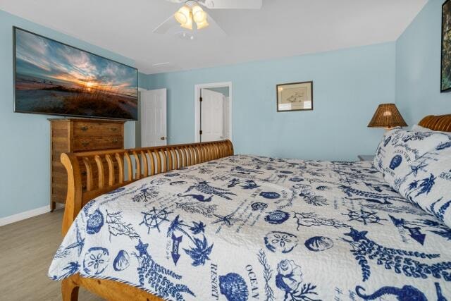 bedroom featuring ceiling fan and light hardwood / wood-style floors