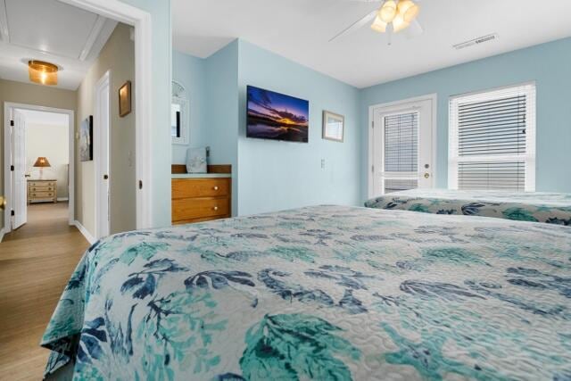 bedroom featuring ceiling fan and light hardwood / wood-style floors