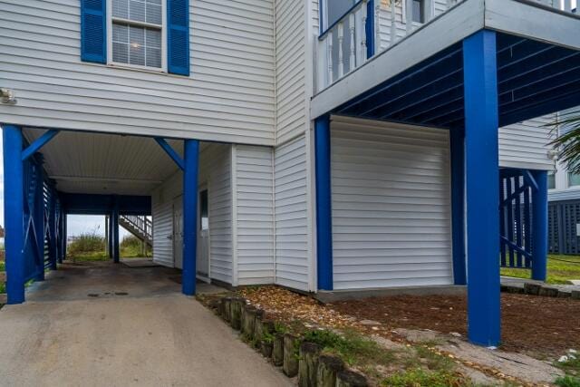 view of side of home featuring a carport