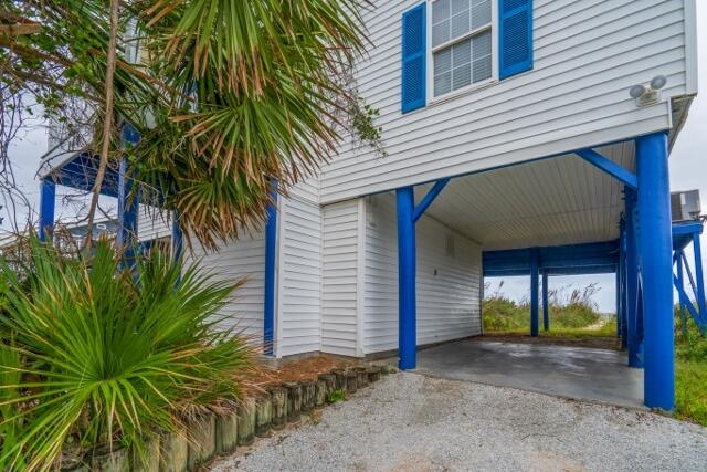 exterior space featuring a carport