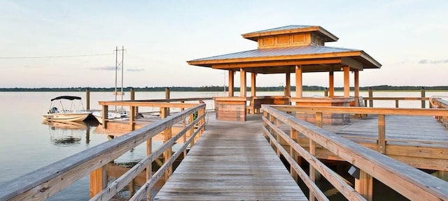 dock area with a water view and a gazebo