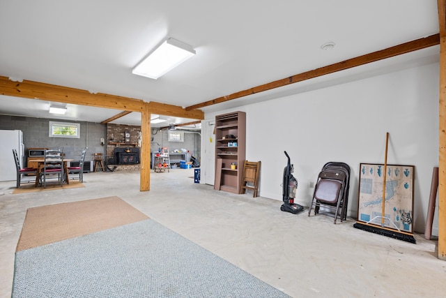 basement featuring freestanding refrigerator