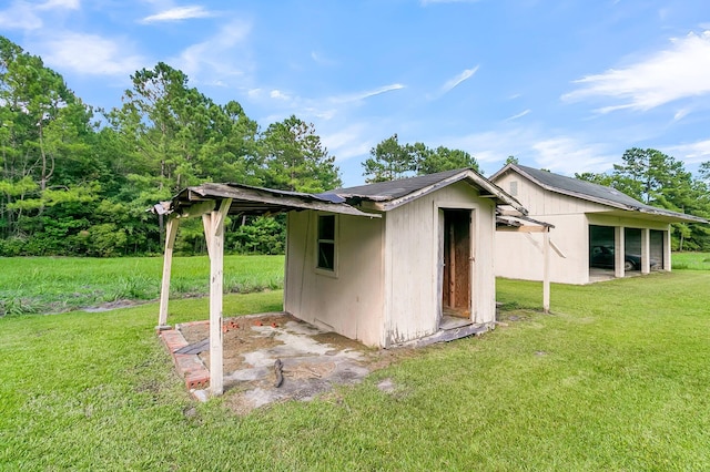 view of outdoor structure with a lawn